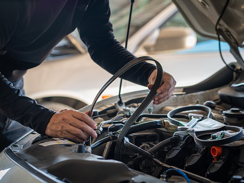 Mechanic working on a car engine